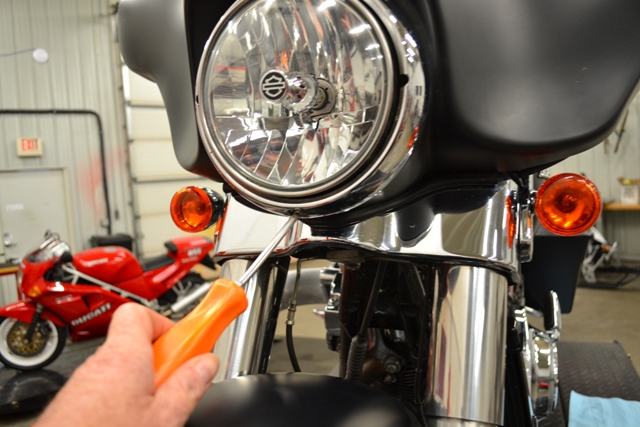 Loosen and remove the headlight lock-ring